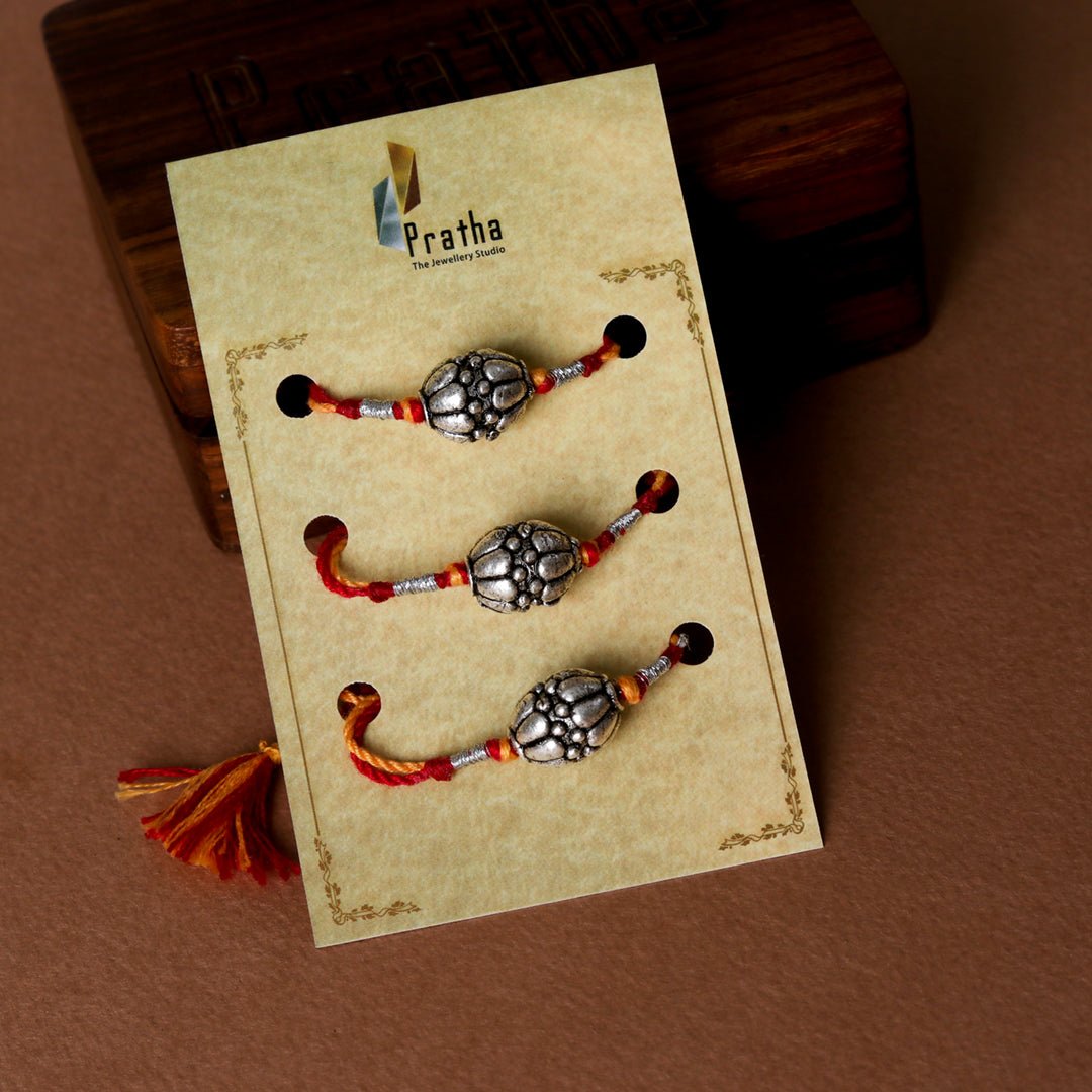 Silver Round Beads Rakhis ( Pack Of 3 ) - Crafted Canvaas